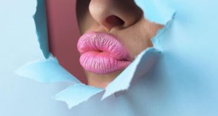 pink-lipstick-through-bright-blue-paper